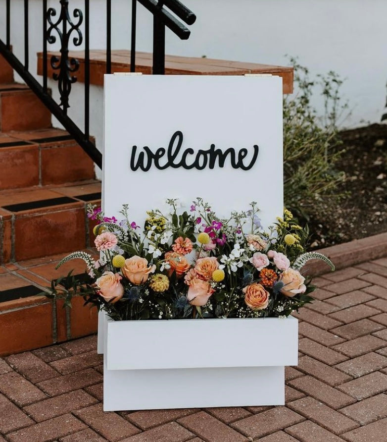 White & Black Welcome Sign