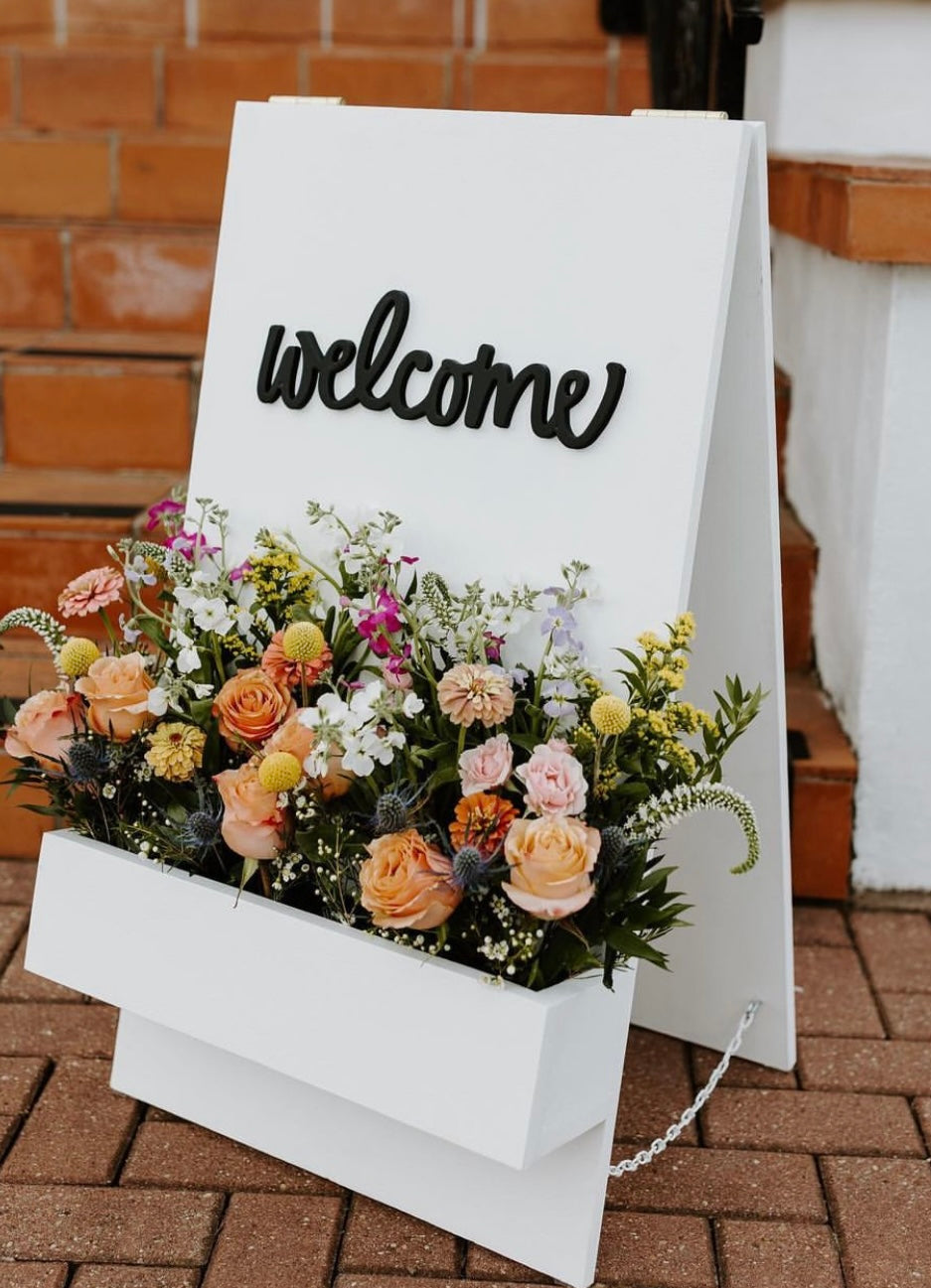 White & Black Welcome Sign